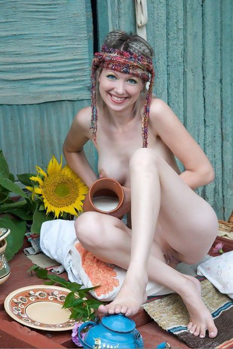 Ukrainian girl with sunflower smiling