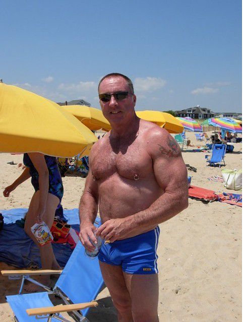 muscle bear on a beach