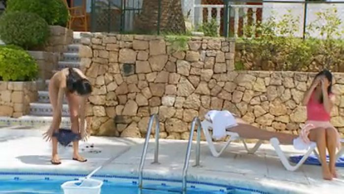 Sweethearts strip nude by the pool